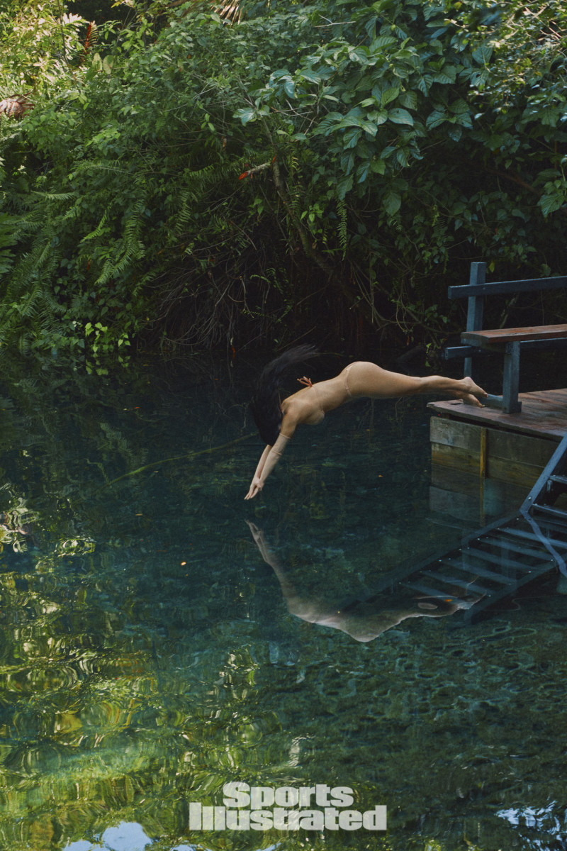 Kim Kardashian was photographed by Greg Swales in the Dominican Republic. Swimsuit by SKIMS. Gloves by SKIMS.